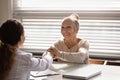 Happy old female patient thanking empathetic doctor for medic care Royalty Free Stock Photo