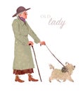 Happy old lady in coat and hat walk a dog in the autumn park. Royalty Free Stock Photo