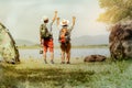 Happy old man friends camping by the water in the forest