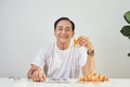 Happy old man positive, Portrait Asian Senior man drinking orange juice from glass Royalty Free Stock Photo