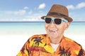 Happy old man wearing sunglasses in the beach Royalty Free Stock Photo