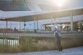 Happy old senior business man using cell phone standing in city outdoors. Royalty Free Stock Photo