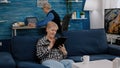 Happy old senior grandmother holding digital tablet browsing informations Royalty Free Stock Photo