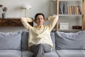 Happy old senior woman resting on comfortable sofa. Royalty Free Stock Photo