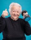 Happy old woman making fitness training with dumbbells Royalty Free Stock Photo