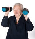 Happy old woman making fitness training with dumbbells Royalty Free Stock Photo