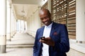 Happy older african businessman with cell phone Royalty Free Stock Photo