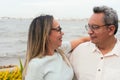 Happy older couple standing in a park Royalty Free Stock Photo