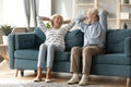 Happy older family relaxing on cozy couch at home Royalty Free Stock Photo