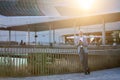 Happy old senior business man using cell phone standing in city outdoors. Royalty Free Stock Photo