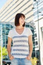 Happy older woman in striped t-shirt standing outside Royalty Free Stock Photo