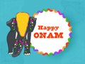 Happy Onam Font Over White Circular Frame With Elephant Animal On Blue Paisley Pattern