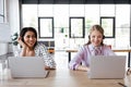 Happy operators in headsets smiling while Royalty Free Stock Photo