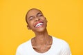 Happy optimistic African American woman laughing