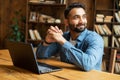 Happy and optimistic Indian man in casual wear using laptop Royalty Free Stock Photo