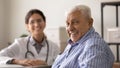 Happy optimistic senior man looking at camera with toothy smile