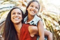 Happy, outdoor and mother giving her child piggyback ride in the garden of the backyard of their home. Happiness, smile Royalty Free Stock Photo