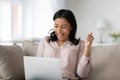 Happy overjoyed African American woman excited with surprising news