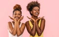 Happy overjoyed two afro women smile broadly