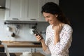 Happy overjoyed woman with smartphone getting unbelievable good news Royalty Free Stock Photo