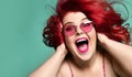 Happy overweight fat woman happy screaming and closing her ears with hands having good time crazy shopping sale Royalty Free Stock Photo