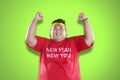 Happy overweight man with healthy resolutions