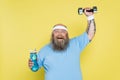 happy overweight man holding sports bottle Royalty Free Stock Photo