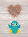 A happy owl throws a multicolored confetti in the shape of a hea