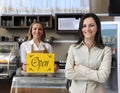 Happy owner of a cafe showing open sign Royalty Free Stock Photo