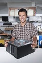 Happy owner of a computer repair store Royalty Free Stock Photo