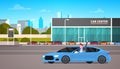 Happy Owner Driving New Car Over Dealership Center Showroom Building Background Royalty Free Stock Photo