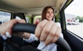 Happy owner. Front view of woman that drives modern new car in the city Royalty Free Stock Photo