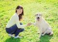 Happy owner woman and labrador retriever dog trains Royalty Free Stock Photo