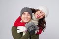 Happy pair of male and female having fun wearing warm clothes