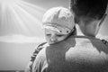 Happy parent with a child by the sea in the open air Royalty Free Stock Photo