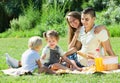 Happy parents with children having picnic outdoor Royalty Free Stock Photo