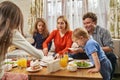 Portrait of family eating festive dinner at home Royalty Free Stock Photo