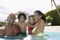 Happy Parents With Children In Swimming Pool Royalty Free Stock Photo