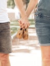 Happy parents concept,young pregnant couple holding small shoes for children in their hands Royalty Free Stock Photo