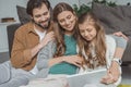 happy parents and daughter using laptop Royalty Free Stock Photo