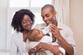 Happy parents feeding their baby boy a bottle Royalty Free Stock Photo