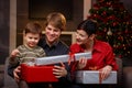 Happy parents giving christmas gifts to son Royalty Free Stock Photo