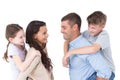 Happy parents giving piggyback ride to children Royalty Free Stock Photo