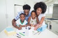 Happy parents helping children with homework Royalty Free Stock Photo