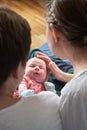 Happy parents holding their newborn baby girl Royalty Free Stock Photo