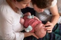 Happy parents holding their newborn baby girl Royalty Free Stock Photo