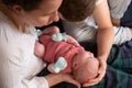 Happy parents holding their newborn baby girl Royalty Free Stock Photo
