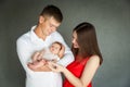 Happy parents holding their newborn baby girl Royalty Free Stock Photo