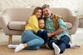 Happy Parents And Kid Daughter Hugging Posing At Home Royalty Free Stock Photo