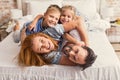 Happy parents and kids enjoying their morning in bed Royalty Free Stock Photo